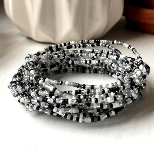 Minimalist Beaded Bracelet Black White Design Glass Seed Beads Small 2mm Size Stretch Comfort Fit Elastic Material Durable Construction Monochrome Pattern Simple Elegant Style Modern Fashion Accessory Everyday Wear Casual Look Versatile