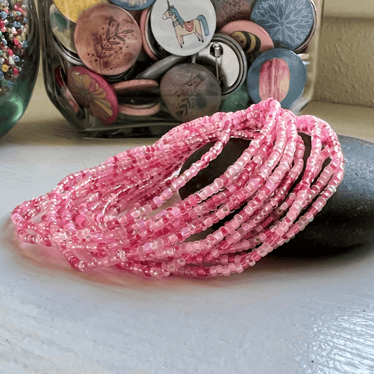 Seed Bead Bracelet Cherry Blossom Theme Dainty Glass Beads Elastic Stretch Design Handmade Jewelry Collection Delicate Pink Floral Pattern Small Size Beads Quality Craftsmanship Stackable Arm Candy Perfect Gift Idea Spring Summer Fashion