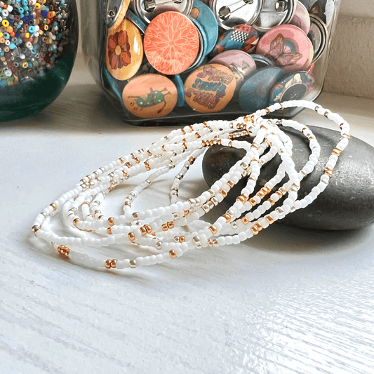 Minimalist White Bracelet Seed Bead Design Stretch Glass Beads Winter White Accessory Everyday Fashion Piece Durable Elastic Band Small Glass Beads Delicate Handcrafted Jewelry Simple Elegant Style Versatile Wardrobe Addition Perfect