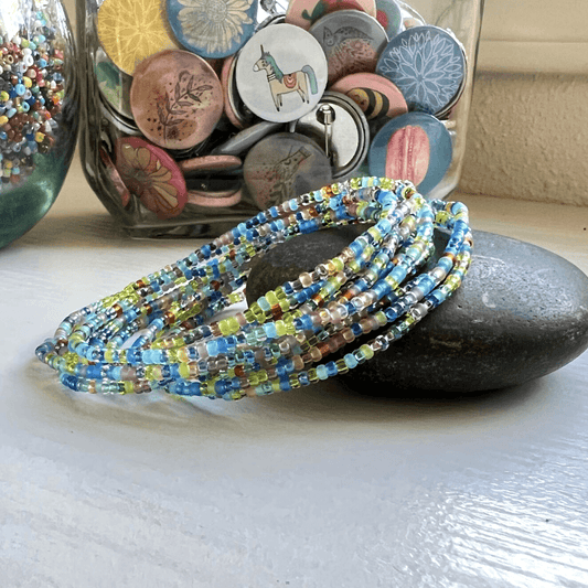 Boho Beaded Bracelet Handmade Wildflower Pattern Glass Seed Beads Stretchy Wrist Accessory Colorful Design Bohemian Style Jewelry Comfortable Elastic Band Everyday Fashion Piece Nature Inspired Colors Durable Construction Small Size Beads