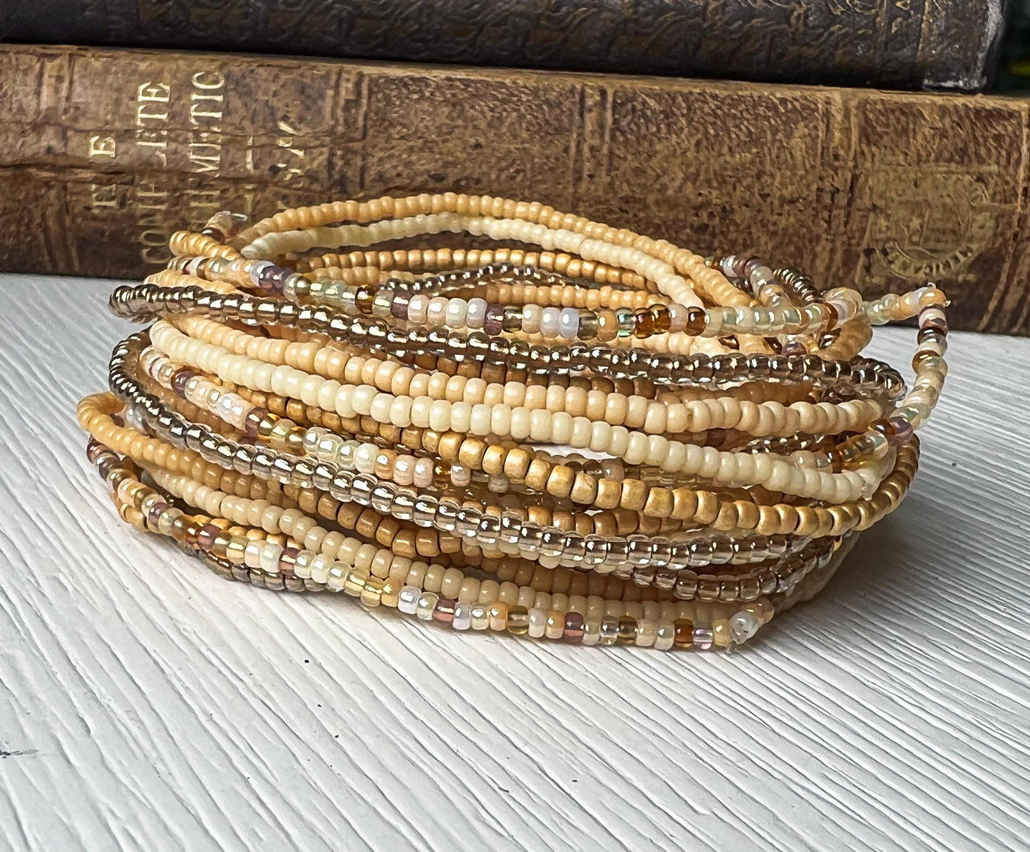 Handmade Seed Bead Bracelet Boho Wrap Style Multi Strand Design Everyday Layering Jewelry Minimalist Beaded Bracelet Neutral Earth Tones Cream Tan Brown Bronze Metallic Silver Glass Beads Stretch Elastic Fit Comfortable All Day Wear