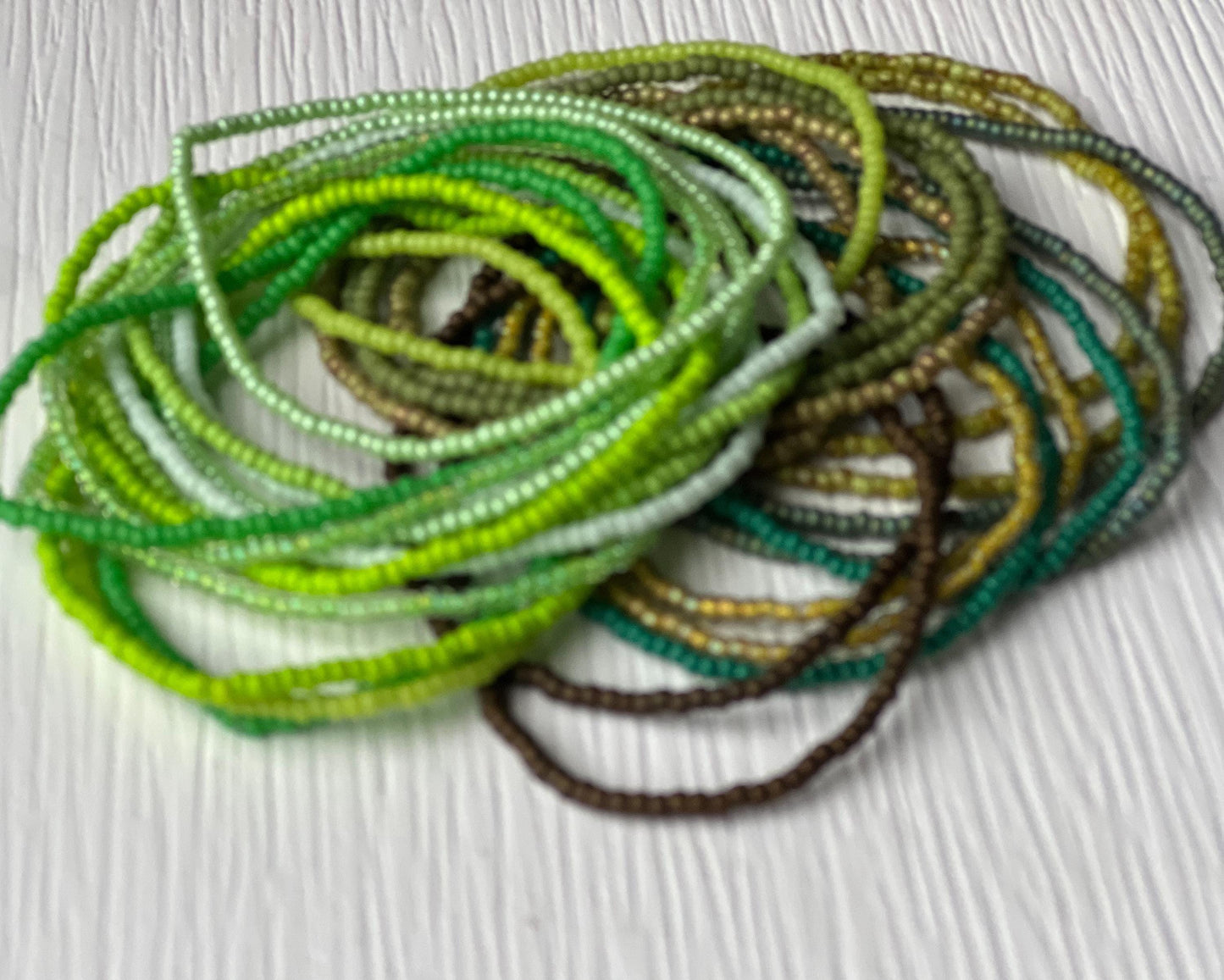 Nature Inspired Bracelet Green Seed Bead Jewelry Stackable Boho Design Stretch Bracelet Collection Forest Mint Earth Tone Colors Summer Layering Accessory Bohemian Style Jewelry Bridesmaid Wedding Gift Handmade Beaded Bracelet Casual