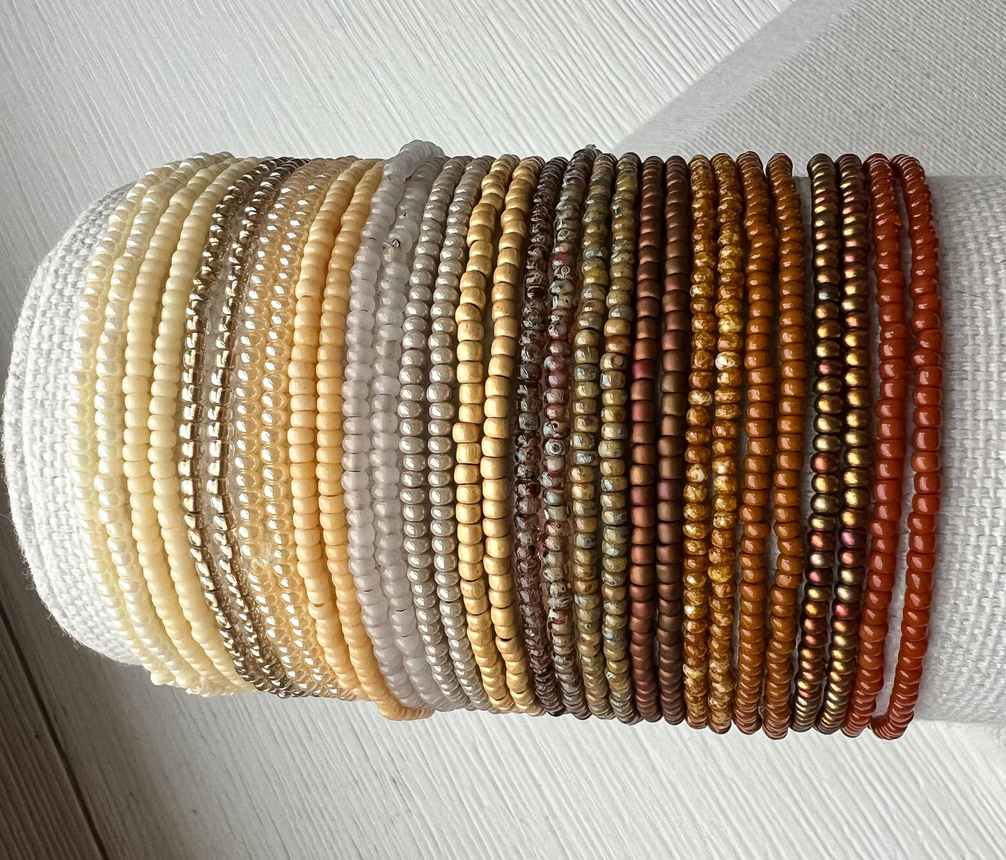Seed Bead Bracelet Stretch Elastic Design Neutral Tone Jewelry Collection Stackable Bracelet Set Minimalist Style Everyday Wear Dainty Beaded Jewelry Layering Bracelet Stack Warm Earth Tones Glass Bead Construction Comfortable Fit Bohemian