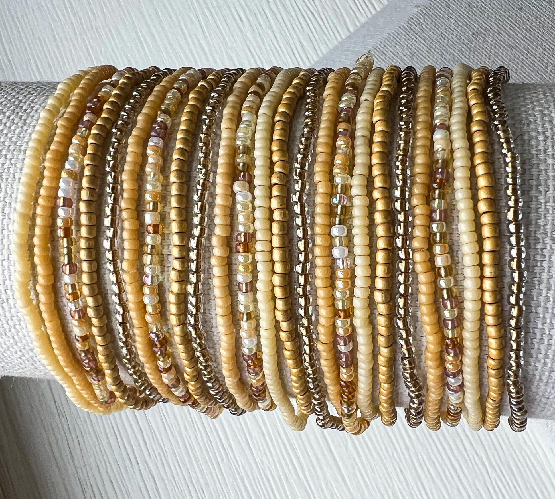 Boho Wrap Bracelet Multi Strand Seed Bead Design Handcrafted Glass Beads Everyday Layering Jewelry Minimalist Beaded Wrap Neutral Tone Bracelet Earth Colors Cream Brown Tan Bronze Silver Stretch Elastic Band Comfortable Fit Stacking Jewelry